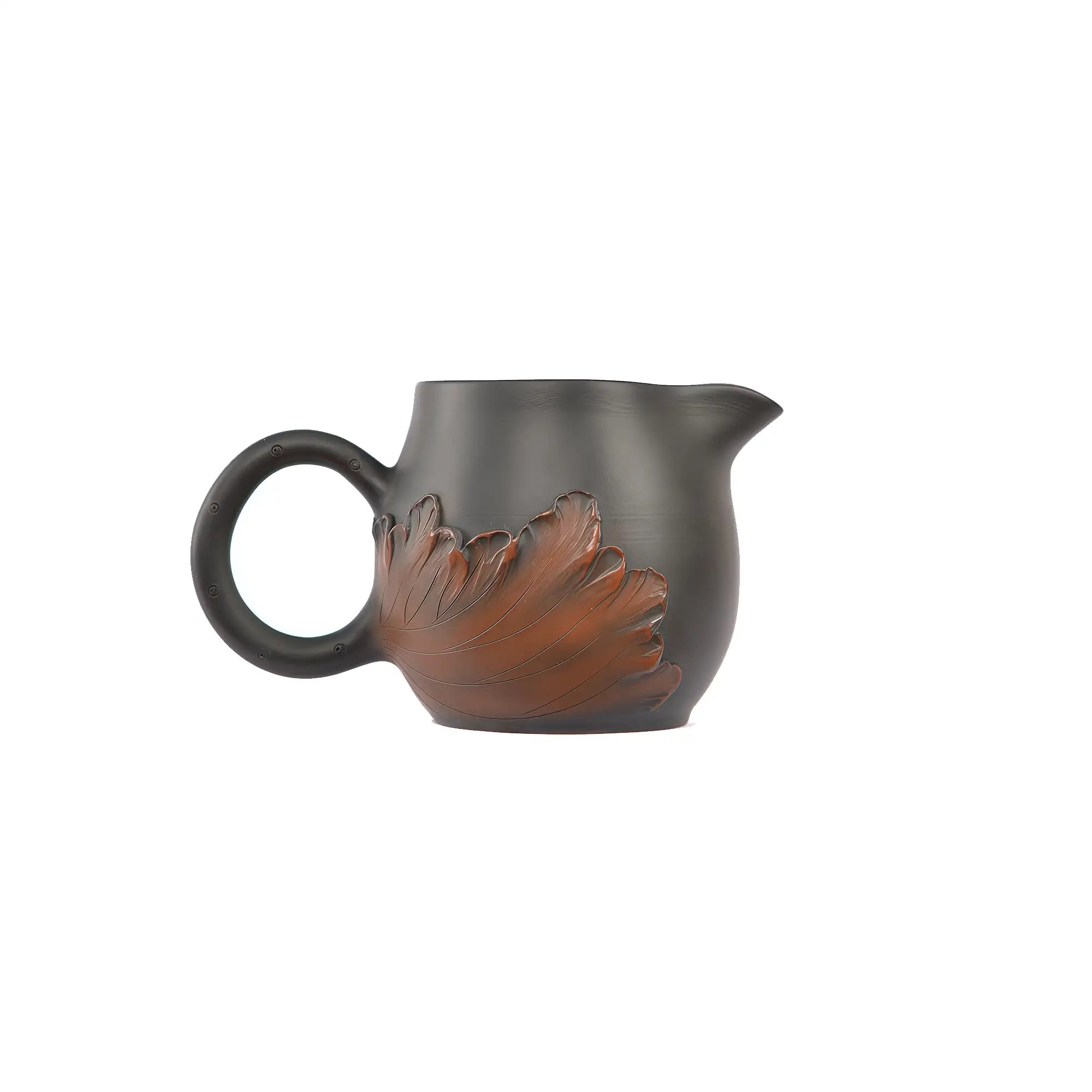 Side view of a Jianshui zitao fairness pitcher with applied lotus leaf relief carving and unglazed matte surface