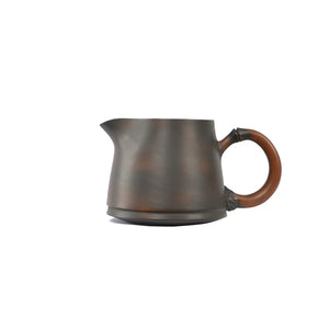 Jianshui zitao fairness pitcher with a plain unglazed body and root-inspired handle