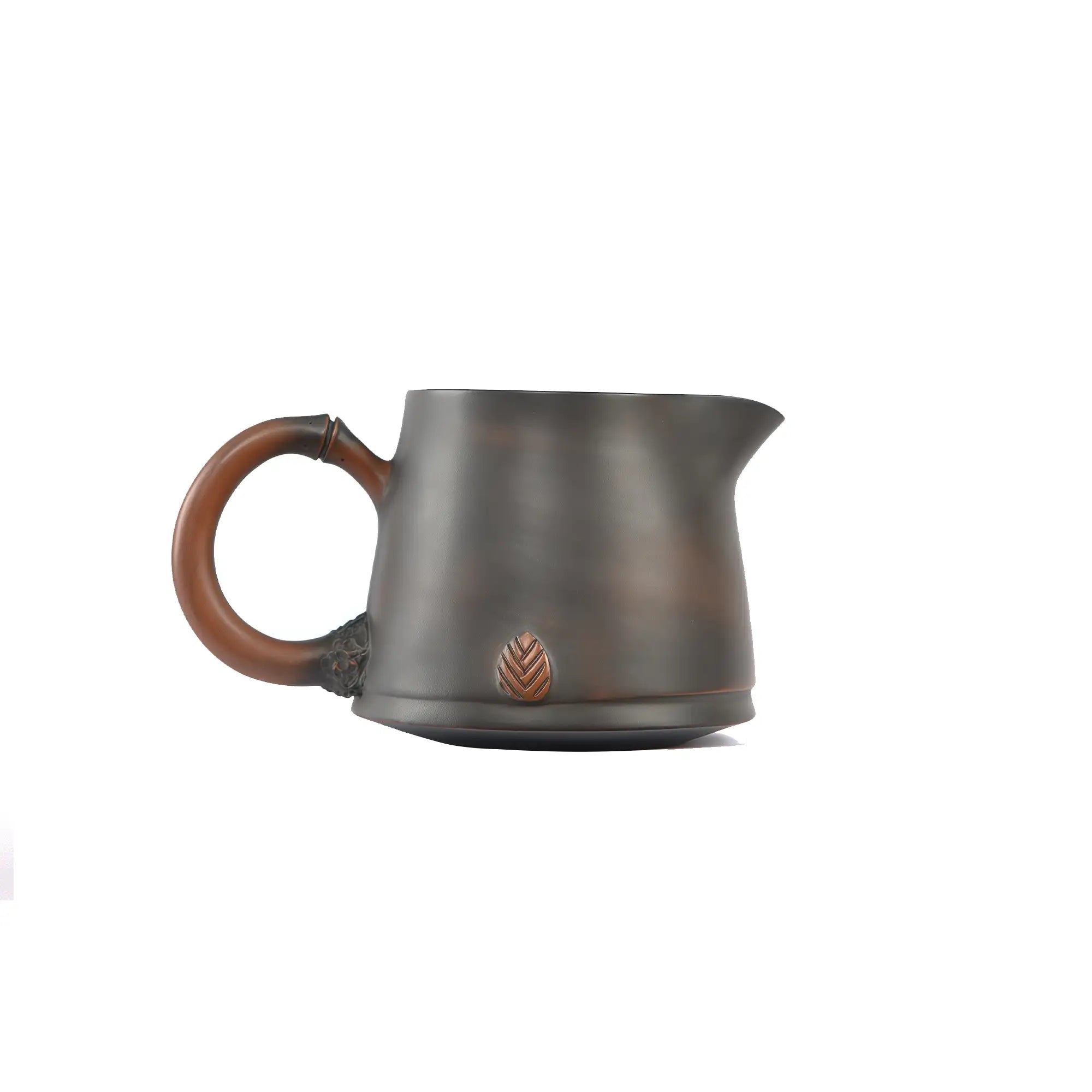 Side view of a Jianshui zitao fairness pitcher featuring a root-inspired handle and a subtle leaf relief near the base
