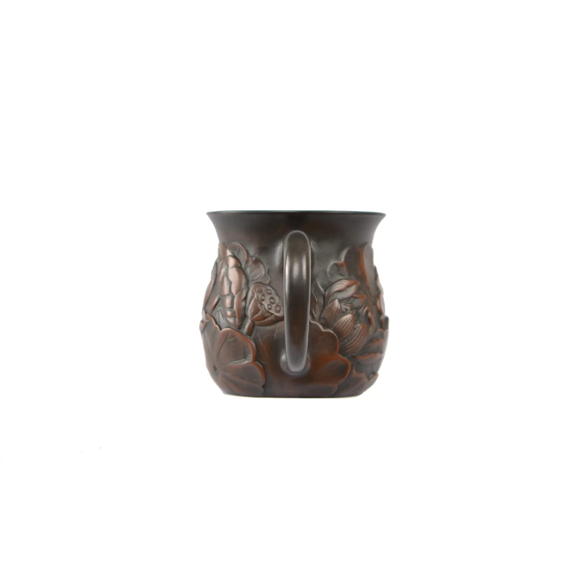 Back view of a Jianshui zitao fairness pitcher showing the curved handle and continuous lotus relief carving