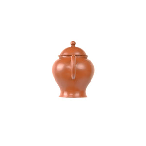 Jianshui zitao red clay teapot with smooth unadorned body, back view.