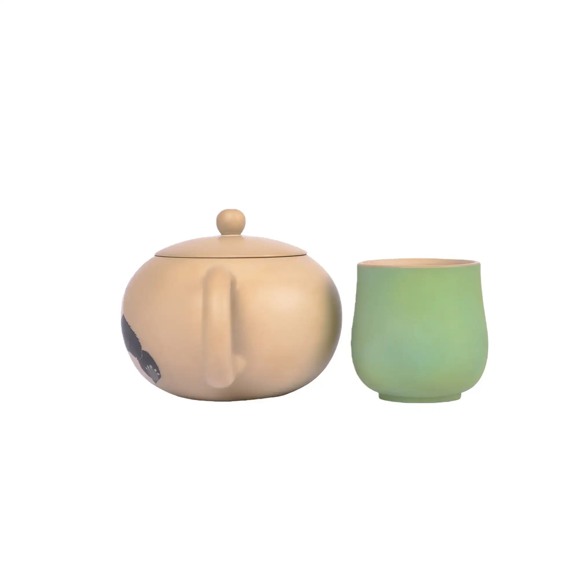 Back view of a Jianshui zitao teapot, shown with a matching green cup