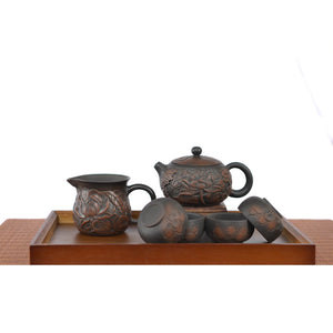 Jianshui zitao tea set with a fully carved lotus teapot, one fairness pitcher, and four matching tea cups