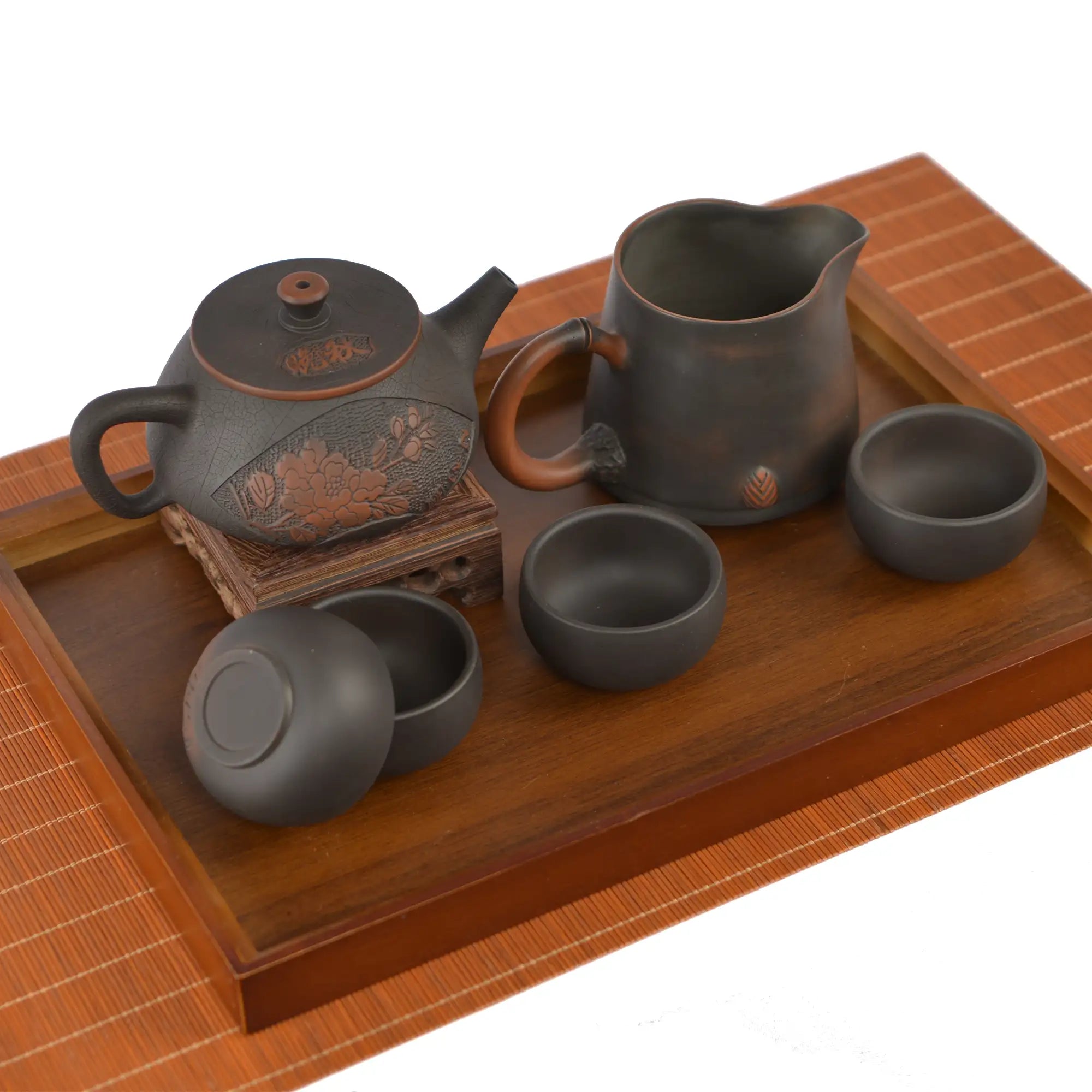 Handmade pottery tea set with a Shi Piao teapot, one fairness pitcher, and four matching tea cups.