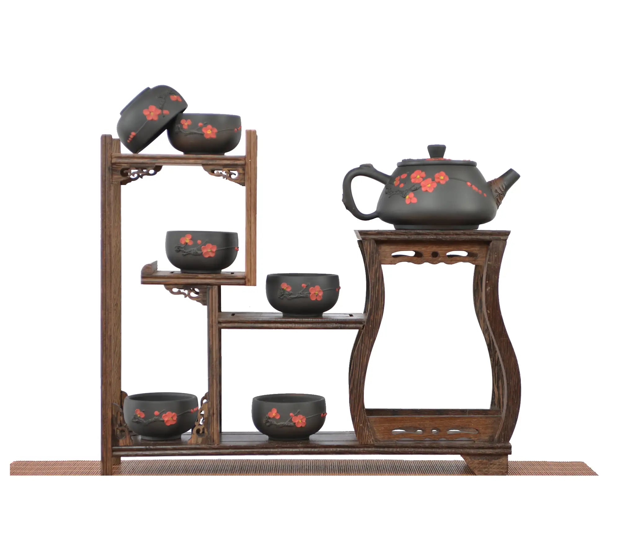 Jianshui zitao root-carved unglazed teapot with a smooth matte finish and plum blossom, arranged with six matching teacups on a tiered wooden display stand