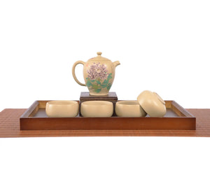 Handcrafted white clay peony teapot and four cups set with floral artwork.