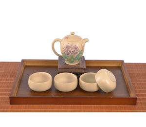 Handcrafted white clay peony teapot set with four matching cups, featuring a hand-carved floral design.