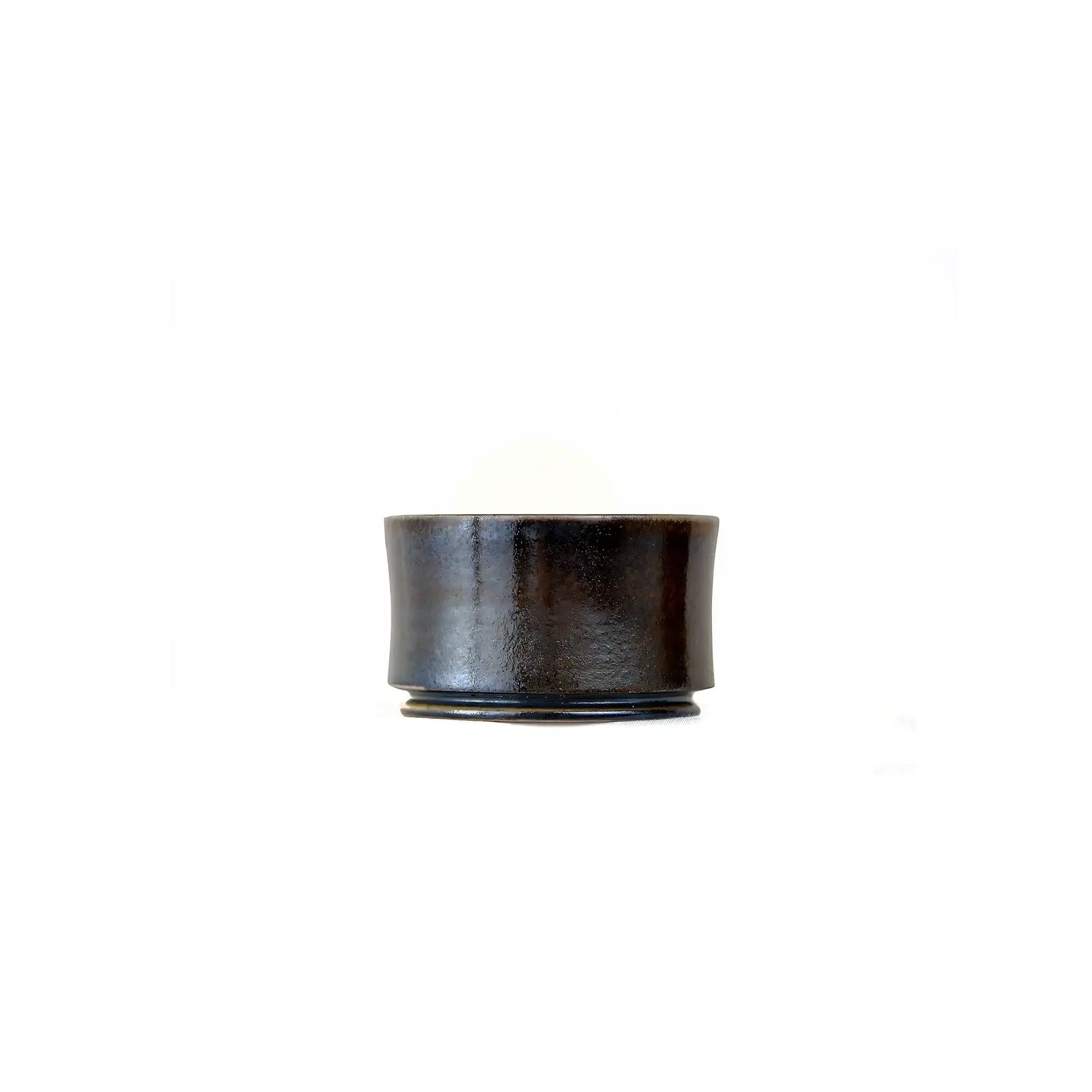 Jianshui zitao wood-fired cup featuring an unglazed surface with natural tactile variation, side view
