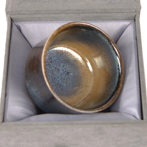 Jianshui zitao wood-fired cup presented on a gift box, emphasizing its one-of-a-kind wood-fired finish