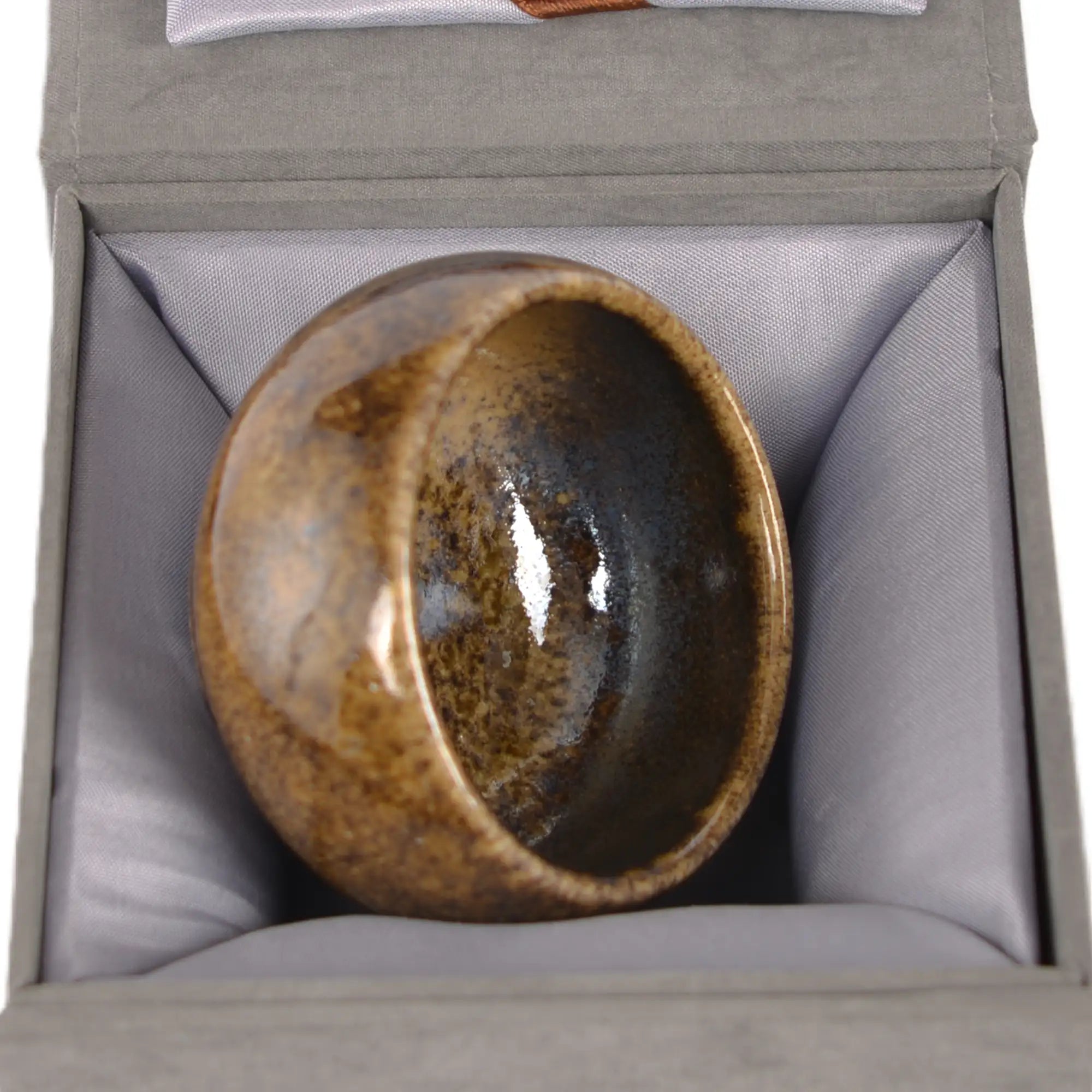 Jianshui zitao wood-fired cup presented on a gift box, emphasizing its natural kiln-fired character