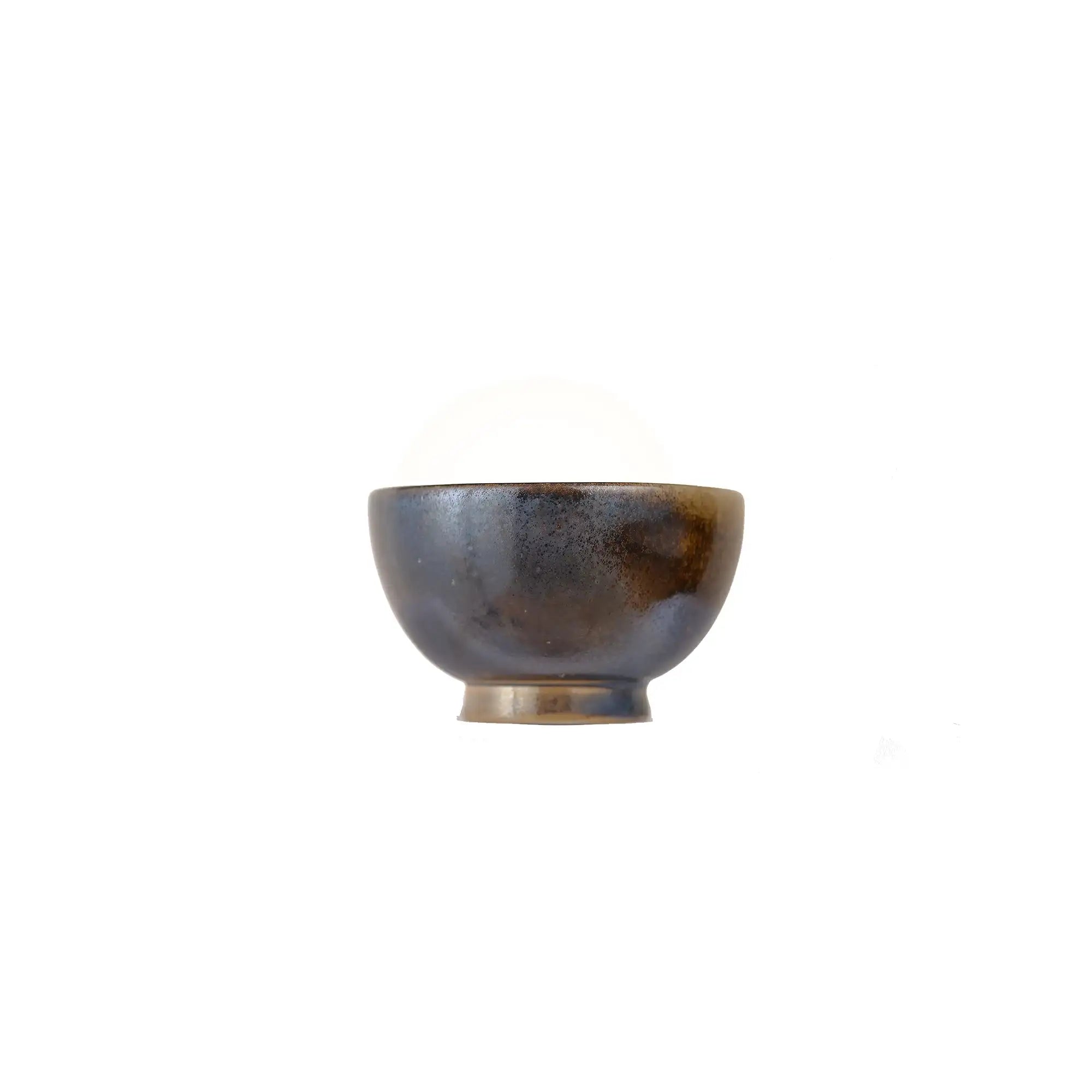 Jianshui zitao wood-fired cup with scattered ash speckling formed naturally in the kiln, side view.