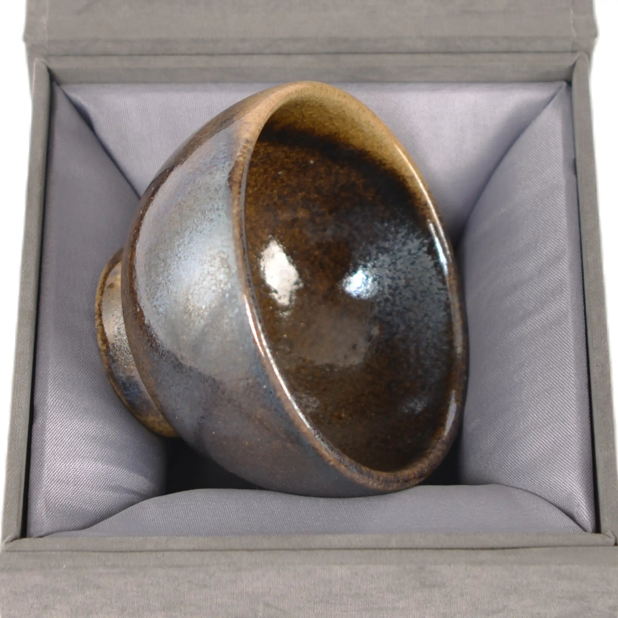 Jianshui zitao wood-fired cup presented on a gift box, emphasizing its natural kiln-fired character