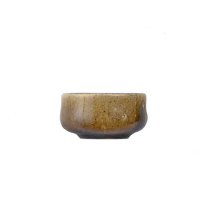 Jianshui zitao wood-fired cup with naturally settled ash tones formed in the kiln, side view