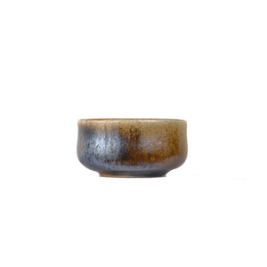 Jianshui zitao wood-fired cup featuring an unglazed surface with organic texture, side view