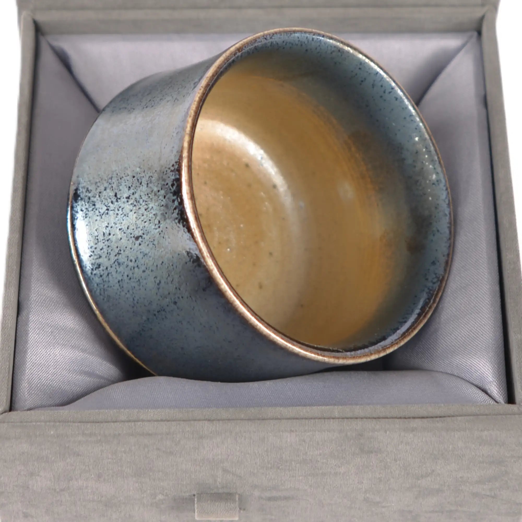 Jianshui zitao wood-fired cup presented on a gift box, emphasizing its one-of-a-kind kiln-fired appearance
