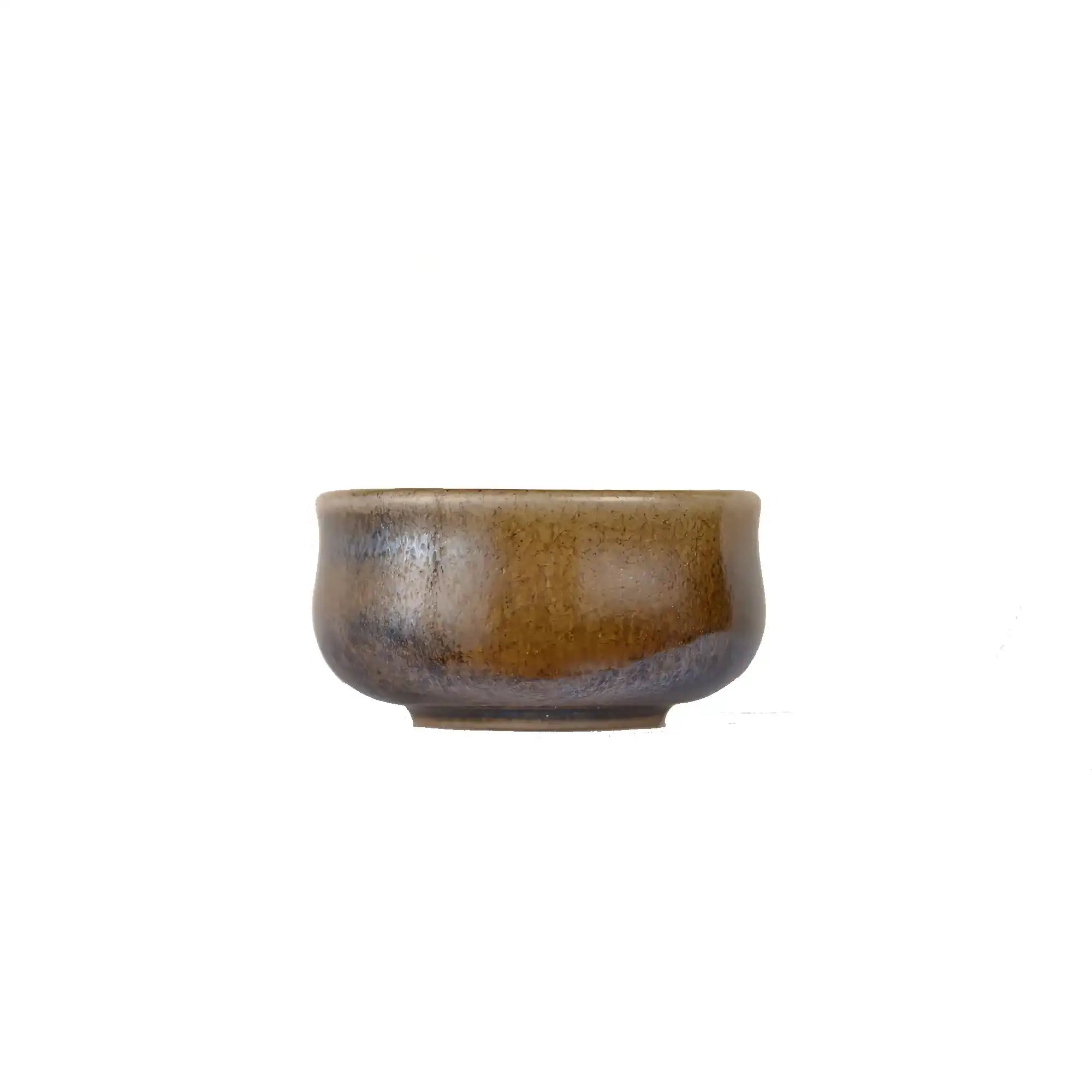 Jianshui zitao wood-fired cup with natural ash deposit and unique surface variation, side view.