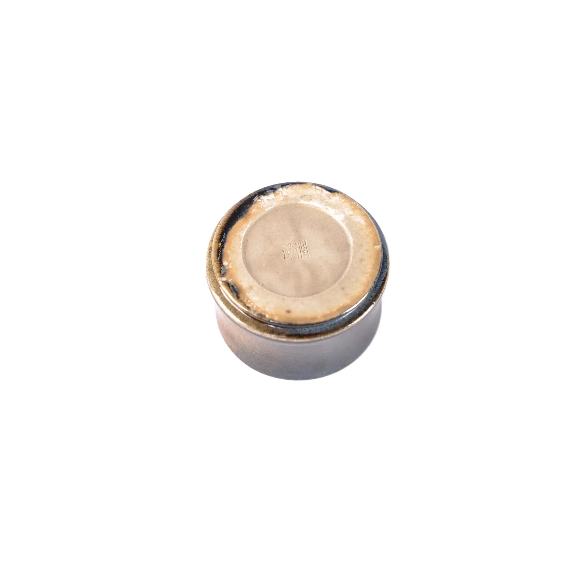 Jianshui zitao wood-fired cup base with natural firing marks and exposed clay foot