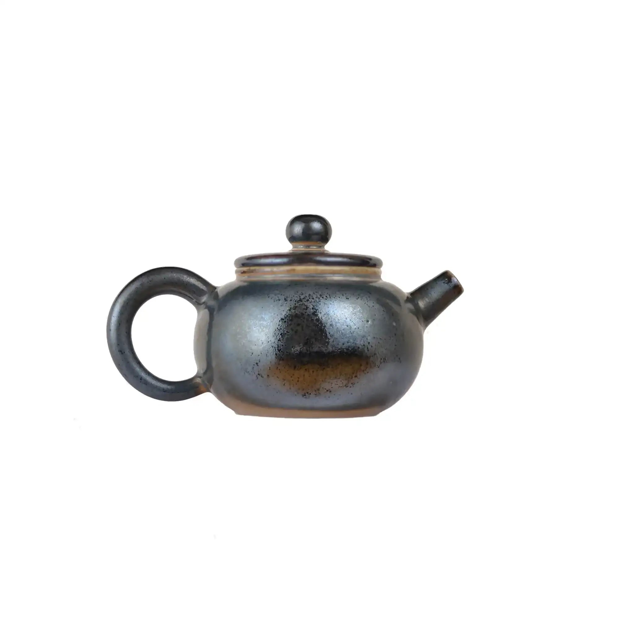 Jianshui zitao wood-fired teapot featuring smoky tonal shading shaped by flame and ash, side view.