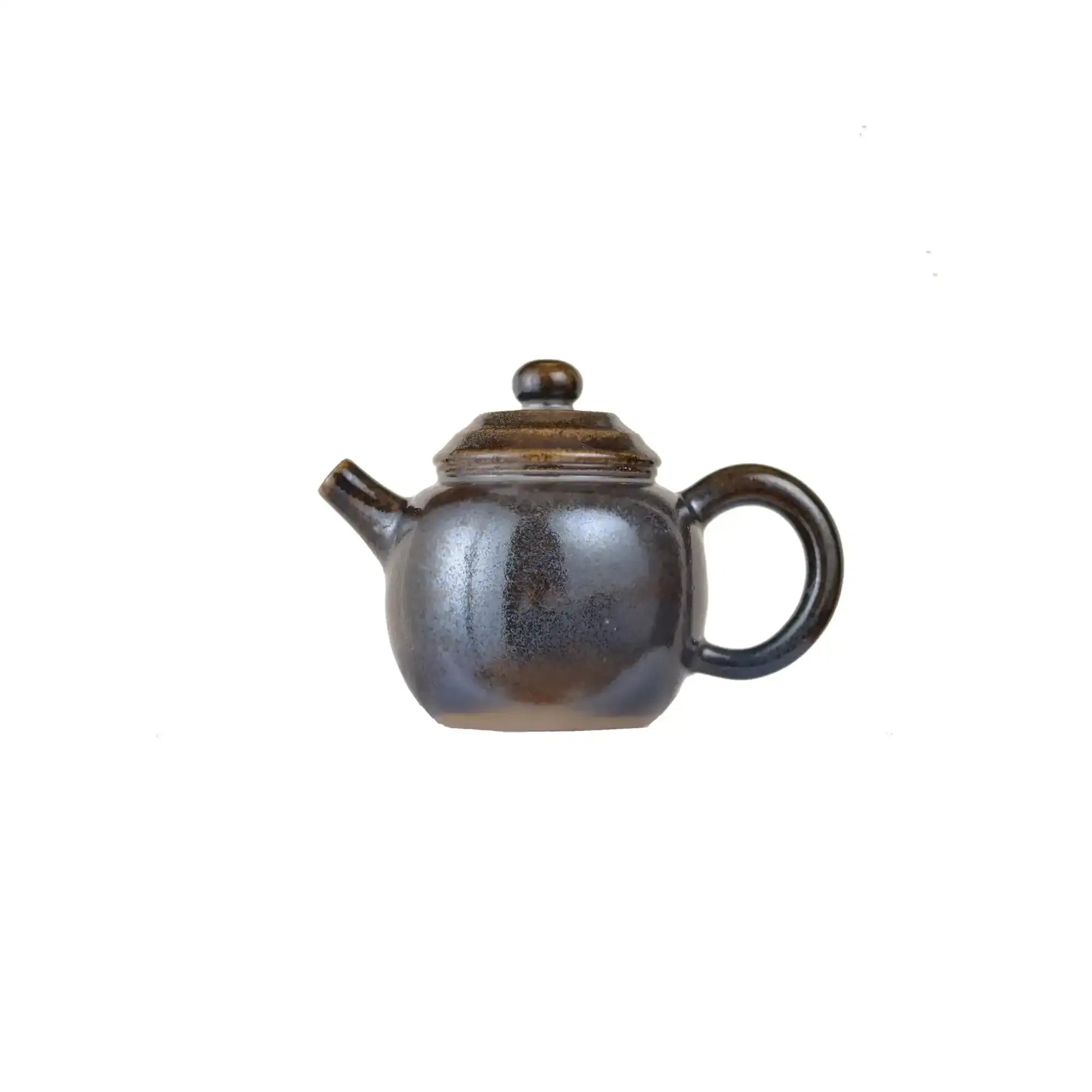 Jianshui zitao wood-fired teapot with mottled natural ash patterns formed during firing, side view.
